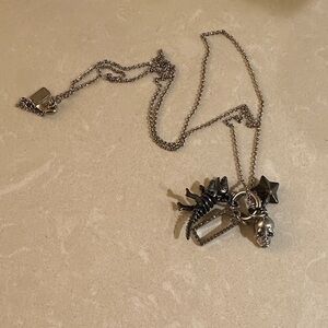 Coach Rexy skull star 4 charm necklace